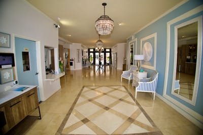 Spacious lobby area with elegant decor and chandeliers