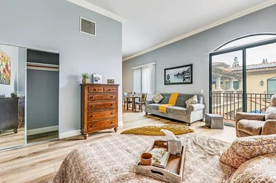 Bright interior of a resident room with balcony access