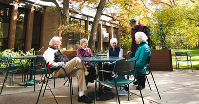 Residents enjoying conversation in an outdoor space