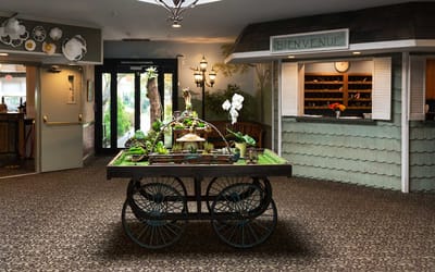 Welcoming interior common area with decorative cart