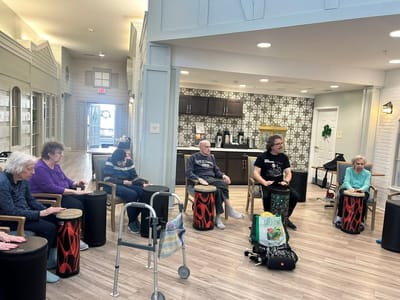 Residents participating in a music activity in a common area