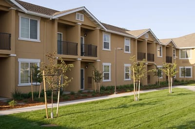 Exterior view of assisted living building with landscaping