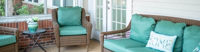 Cozy seating area with green cushions and table