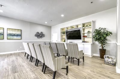 Interior view of a common area with seating and a TV