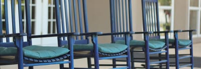 Row of rocking chairs on a patio
