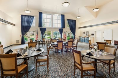 Interior view of a dining area with tables and chairs