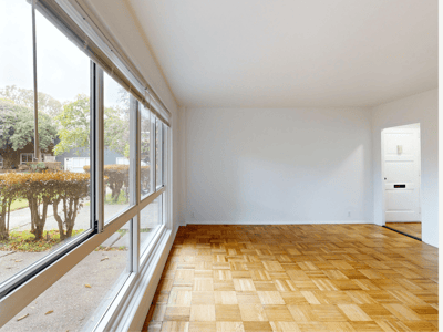Bright, empty interior space with large windows