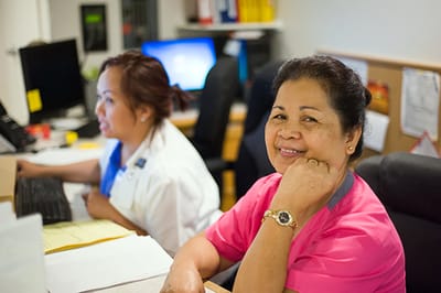 Staff member smiling in office setting