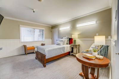 Cozy private resident room with a bed and decorative elements