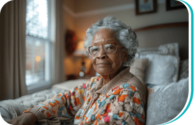 Senior woman with glasses sitting comfortably indoors