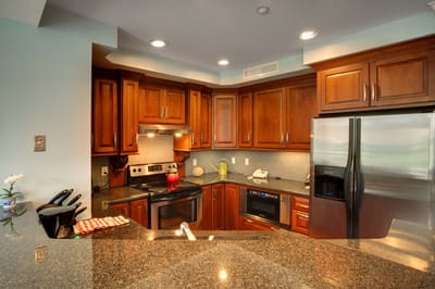 Modern kitchen area with wooden cabinets