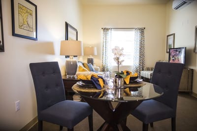 Cozy dining setup in a resident suite with decor