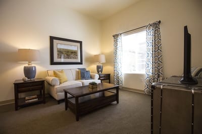 Cozy living area in a resident's private room
