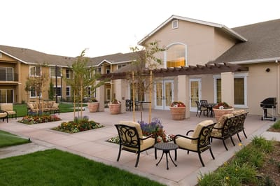 Outdoor seating area with landscaped gardens