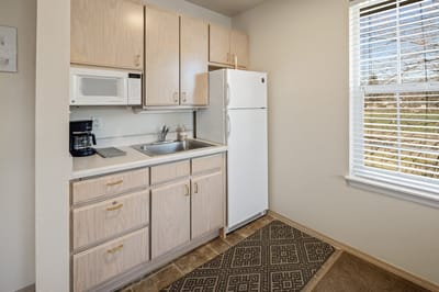 Resident kitchenette with appliances and natural light