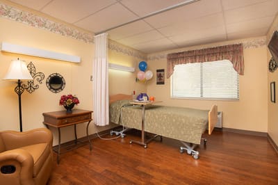 Bright resident room with balloons and flowers