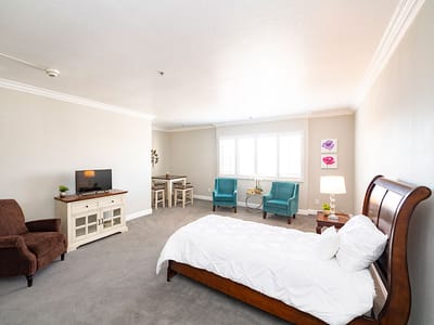 Interior view of a private resident room with furniture
