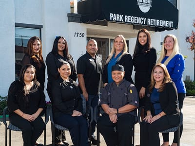 Staff members posing in front of the Park Regency Retirement Center