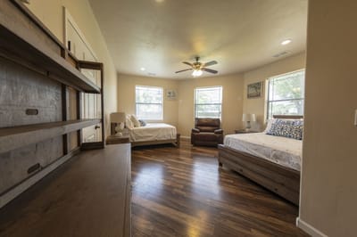 Brightly lit shared resident room with two beds