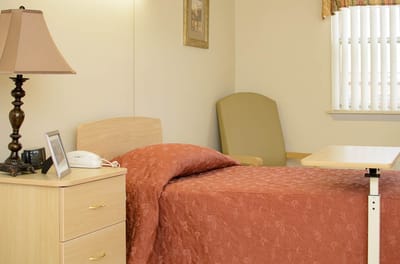 Cozy resident room with bed and furnishings