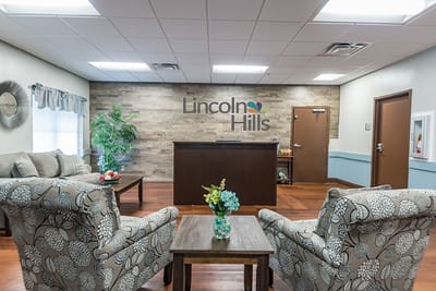 Bright common area with a reception desk and seating