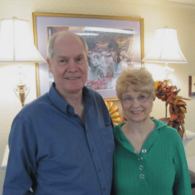 Two residents smiling in a cozy indoor setting