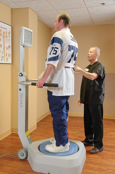 Physical therapy session with a resident and staff