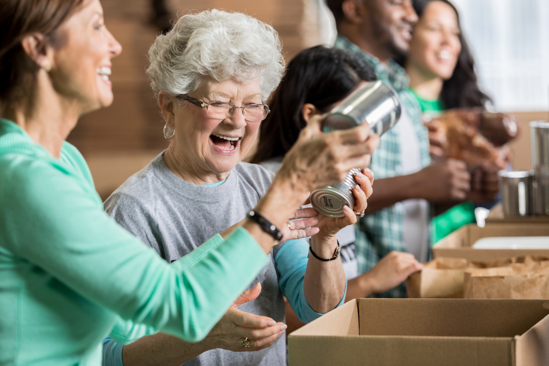 Residents and staff volunteering together in an activity