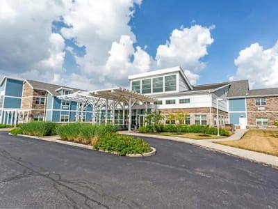 Exterior view of The Springs of Mooresville with gardens