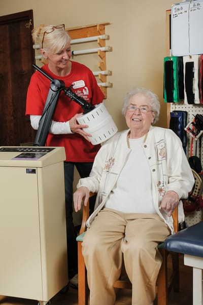 Staff member assisting a resident in a therapy session
