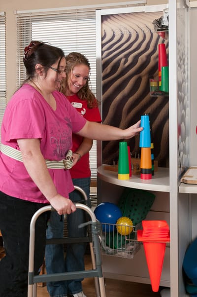 Residents engaging in a therapeutic activity indoors
