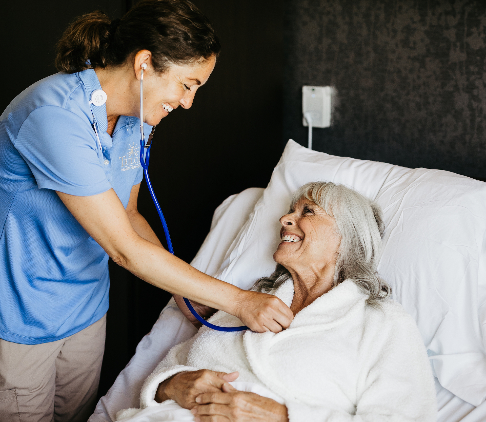Staff member interacting with a resident in a care environment