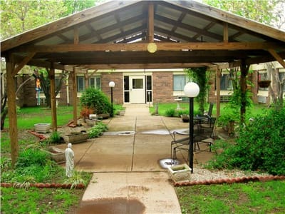 Outdoor gathering space with seating and landscaping