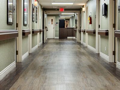 Well-lit corridor in a senior living facility
