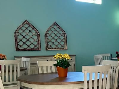 Bright interior space with a table and flowers