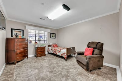 Private resident room with bed and seating area