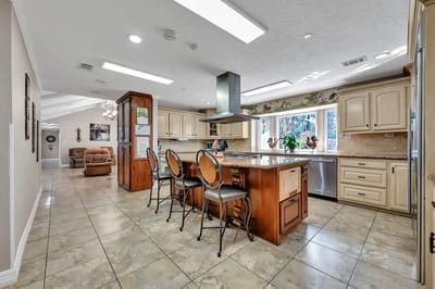 Bright, modern kitchen space with seating