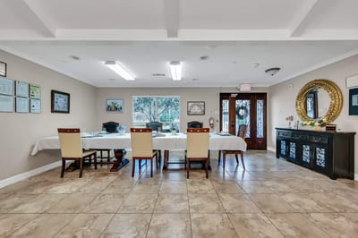 Interior view of a dining room with tables and chairs