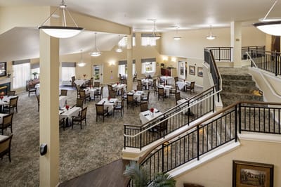 Interior view of a dining room with tables and chairs