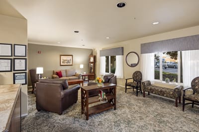 Cozy lounge area with seating and natural lighting