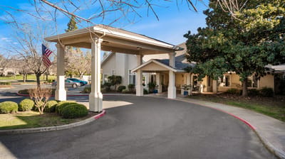 Entrance of a senior living facility with a covered porch