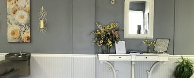 Brightly decorated interior space with flowers and a mirror