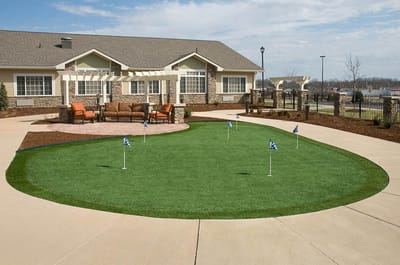 Outdoor putting green with seating area