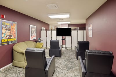 Interior view of a lounge area with chairs and decor