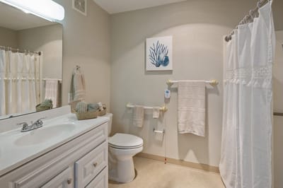 Bright, clean bathroom with floral decor