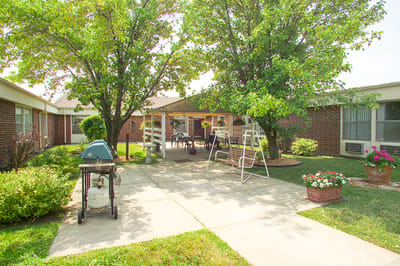 Outdoor space with trees and seating area