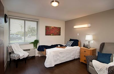 Cozy resident room with bedding and decor
