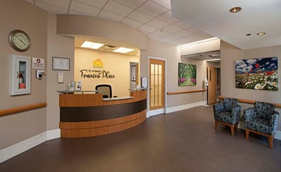 Interior lobby with front desk and seating area