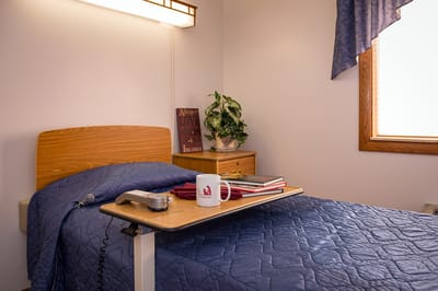 Cozy resident room with bed and personal items