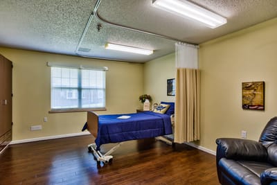 Private resident room with bed and furnishings